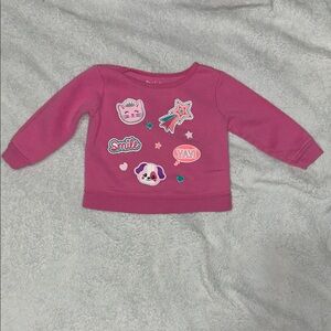 Pink sticker/patch sweater